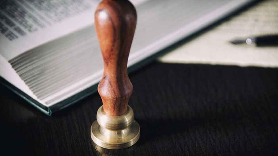 rubber stamper on a desk